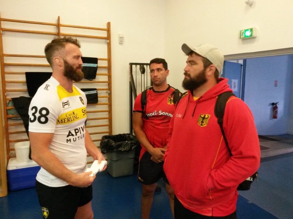 WRA Trainer Poppmeier und Rodriguez im Gespräch mit All Black Jason Eaton