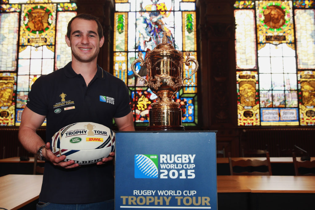 HEIDELBERG, GERMANY - APRIL 17: Sean Armstrong and the Webb Ellis Cup at Heidelberg city hall as part of Rugby World Cup Trophy Tour, delivered in partnership with Land Rover and DHL on April 17, 2015 in Heidelberg, Germany. (Photo by Alex Grimm/Getty Images for England Rugby 2015)